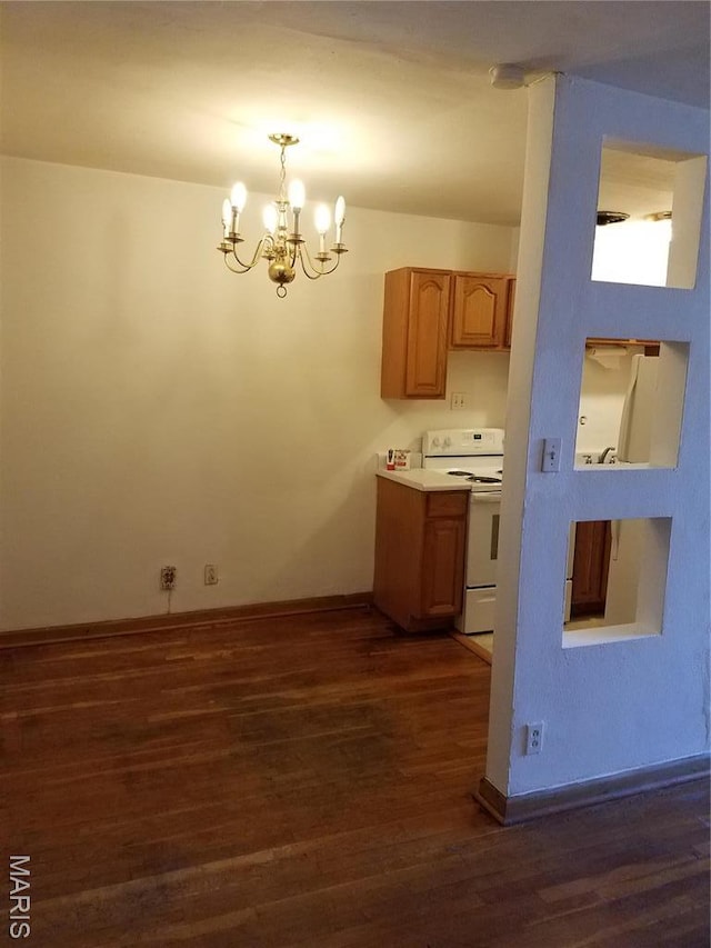 kitchen featuring white electric range oven, dark wood-style flooring, a chandelier, baseboards, and light countertops