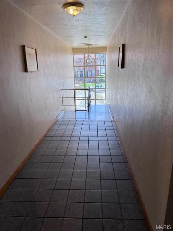 empty room with dark tile patterned floors
