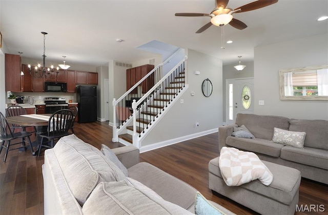 2122 Birchwood Dr, Barnhart, MO 63012 - living area featuring ceiling fan, dark wood-style floors, stairs, a chandelier, and baseboards