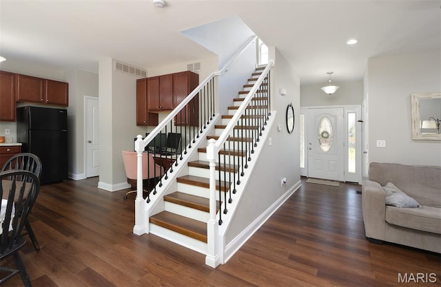 2122 Birchwood Dr, Barnhart, MO 63012 - foyer entrance with stairs, dark wood-style flooring, baseboards, and recessed lighting
