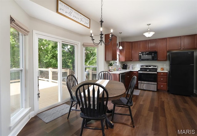 2122 Birchwood Dr, Barnhart, MO 63012 - dining room with plenty of natural light, dark wood-style floors, and a chandelier
