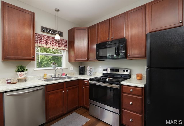 2122 Birchwood Dr, Barnhart, MO 63012 - kitchen featuring black appliances, a sink, light countertops, and dark wood finished floors
