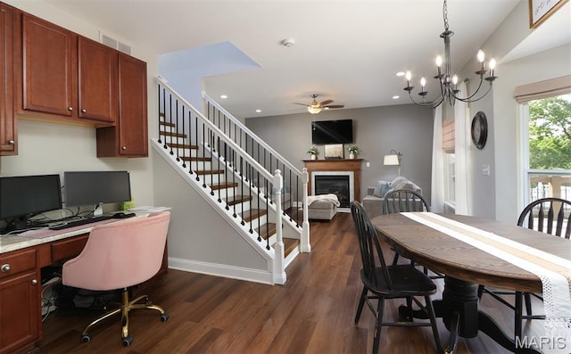 2122 Birchwood Dr, Barnhart, MO 63012 - dining area with a ceiling fan, dark wood-style flooring, a desk, a glass covered fireplace, and baseboards