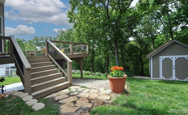 2122 Birchwood Dr, Barnhart, MO 63012 - view of green lawn with stairs, a storage shed, a wooden deck, and an outbuilding