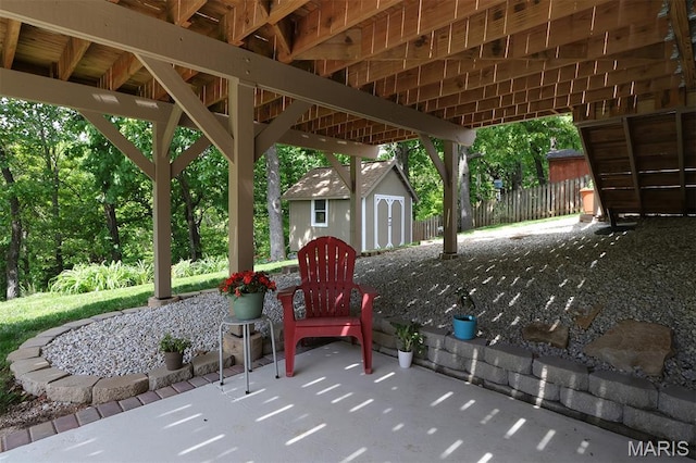 2122 Birchwood Dr, Barnhart, MO 63012 - view of patio with a storage shed, an outdoor structure, and fence
