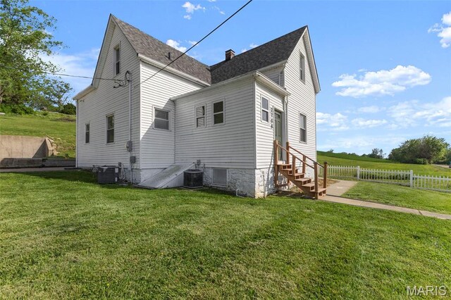 2708 Old State Route 3, Columbia, IL 62236 - view of side of property featuring central AC, entry steps, a chimney, and a shingled roof