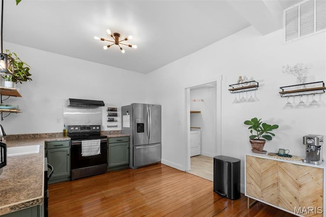2708 Old State Route 3, Columbia, IL 62236 - kitchen with black range with electric stovetop, stainless steel fridge, a sink, washer / dryer, and a chandelier