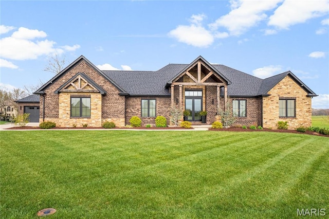 craftsman inspired home featuring brick siding, a front lawn, a shingled roof, and a garage