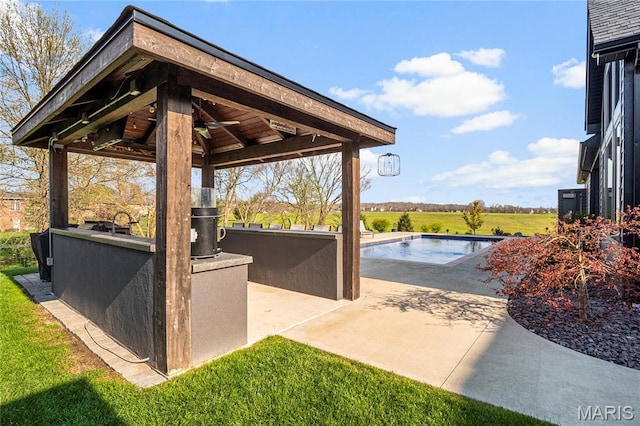 view of patio featuring a gazebo and an outdoor pool
