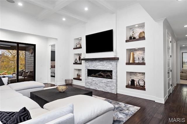 living room featuring beamed ceiling, wood-type flooring, baseboards, a stone fireplace, and recessed lighting