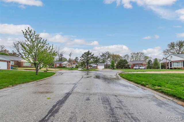view of asphalt road featuring a residential view