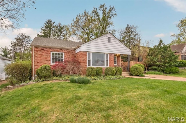 view of front of house with brick siding and a shingled roof