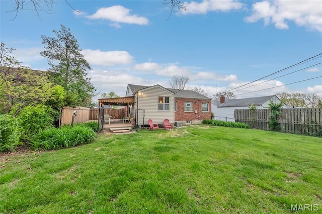 back of property featuring a wooden deck and brick siding