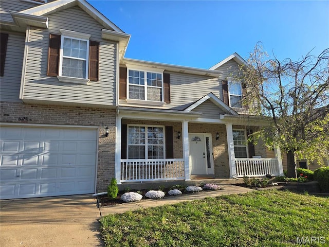 6029 Timber Hollow Ln, High Ridge, MO 63049 - view of front of property featuring a porch, brick siding, a garage, and driveway