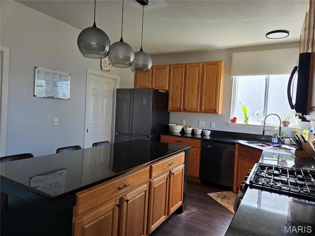 6029 Timber Hollow Ln, High Ridge, MO 63049 - kitchen featuring black appliances, a sink, dark wood-type flooring, a kitchen island, and dark stone counters
