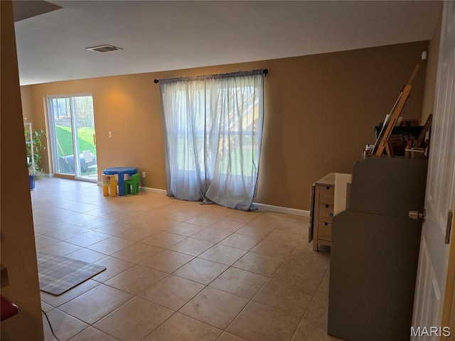 6029 Timber Hollow Ln, High Ridge, MO 63049 - spare room featuring light tile patterned flooring and baseboards