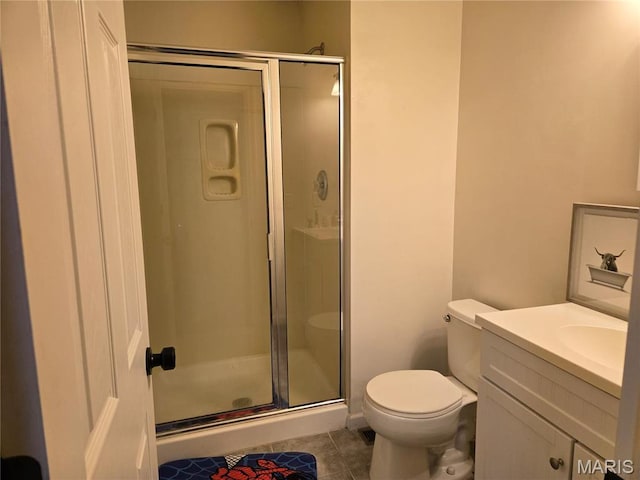 6029 Timber Hollow Ln, High Ridge, MO 63049 - full bathroom with tile patterned flooring, a shower stall, toilet, and vanity