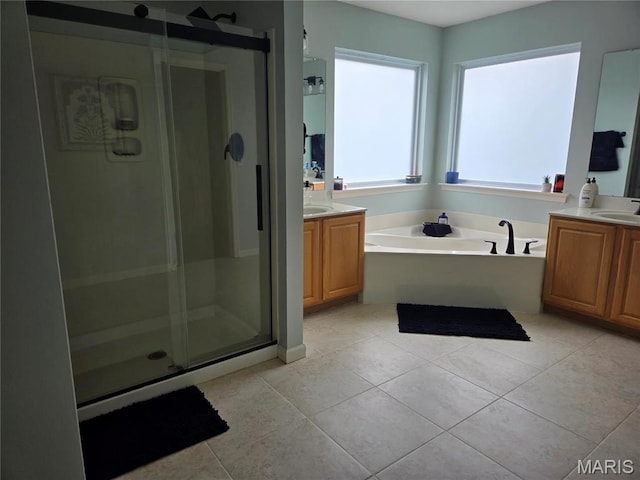 6029 Timber Hollow Ln, High Ridge, MO 63049 - bathroom featuring a shower stall, vanity, tile patterned floors, and a garden tub