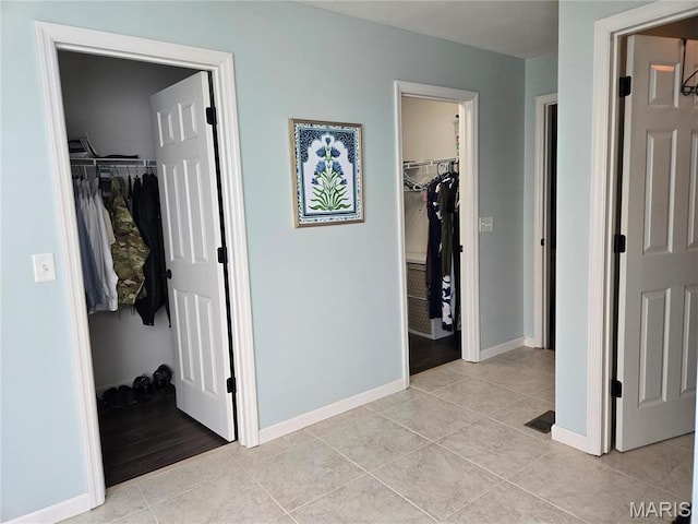 6029 Timber Hollow Ln, High Ridge, MO 63049 - hallway with light tile patterned floors and baseboards