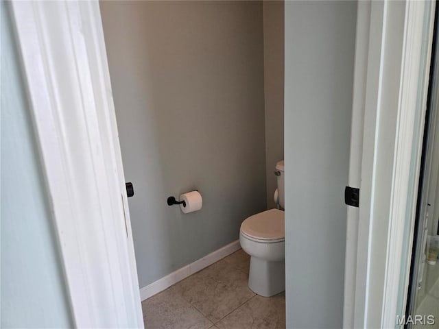 6029 Timber Hollow Ln, High Ridge, MO 63049 - bathroom with toilet, tile patterned floors, and baseboards