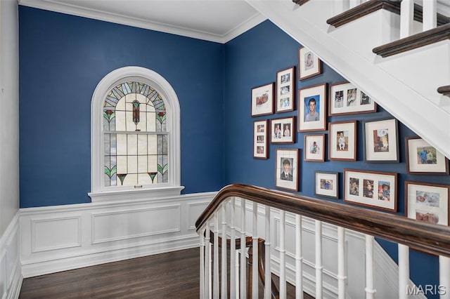 582 S Berry Rd, Webster Groves, MO 63122 - staircase with a wainscoted wall, wood finished floors, crown molding, and a decorative wall