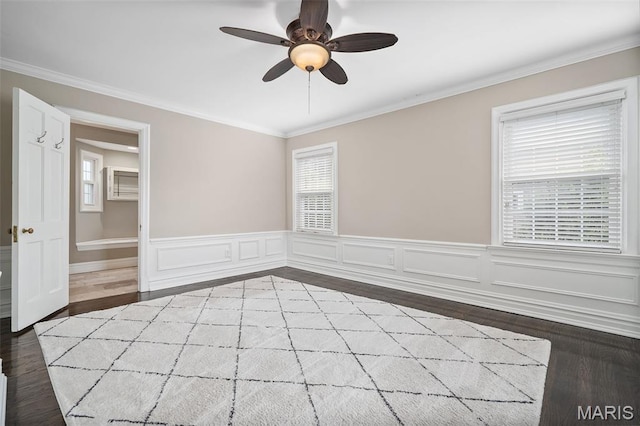 582 S Berry Rd, Webster Groves, MO 63122 - spare room featuring ceiling fan, crown molding, plenty of natural light, wood finished floors, and wainscoting