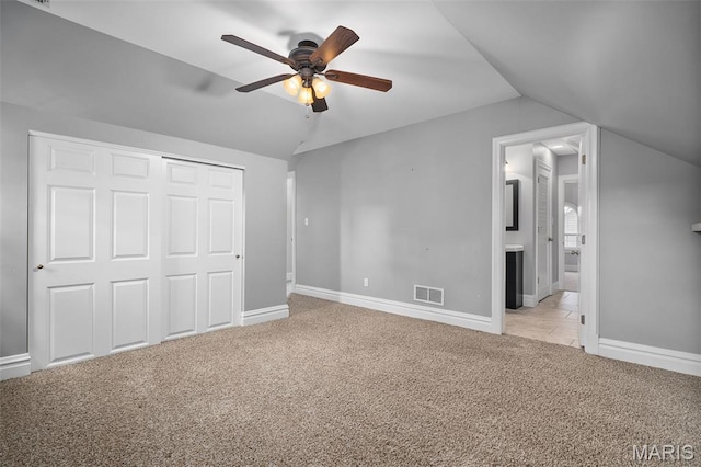 582 S Berry Rd, Webster Groves, MO 63122 - unfurnished bedroom with lofted ceiling, carpet flooring, a closet, baseboards, and ensuite bath