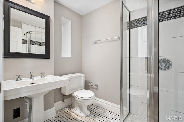 582 S Berry Rd, Webster Groves, MO 63122 - bathroom featuring toilet, baseboards, a stall shower, and tile patterned floors