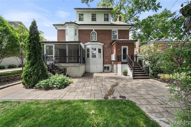 582 S Berry Rd, Webster Groves, MO 63122 - view of front of house with a sunroom, brick siding, and stairway