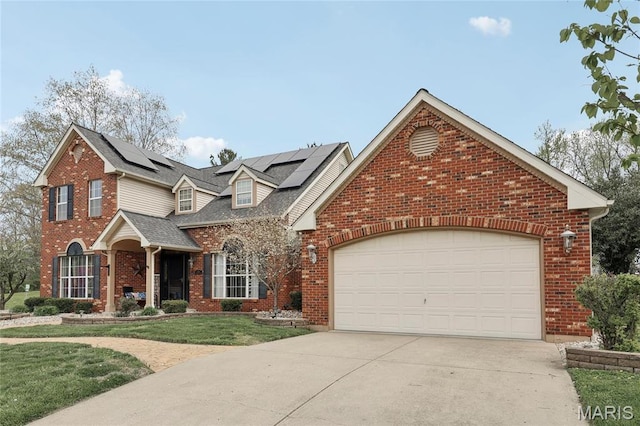 1001 Hawthorne Pl, Ofallon, IL 62269 - traditional-style home with brick siding, driveway, a front yard, an attached garage, and solar panels