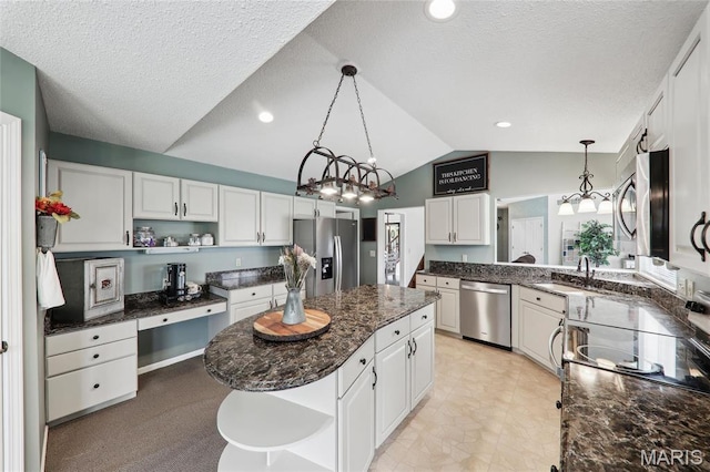 1001 Hawthorne Pl, Ofallon, IL 62269 - kitchen with open shelves, stainless steel appliances, a kitchen island, lofted ceiling, and white cabinets