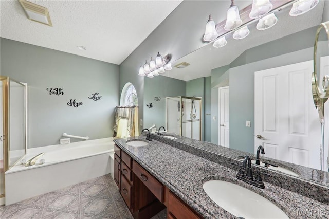 1001 Hawthorne Pl, Ofallon, IL 62269 - bathroom featuring a garden tub, a shower stall, double vanity, and a textured ceiling