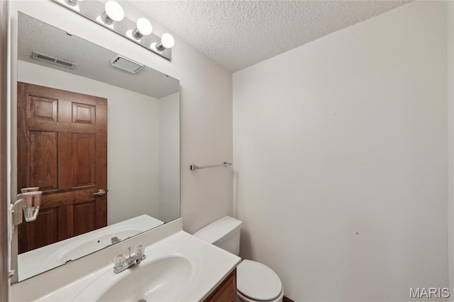 1001 Hawthorne Pl, Ofallon, IL 62269 - bathroom featuring toilet, a textured ceiling, and vanity