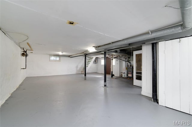 811 Marvin Ave, Saint Louis, MO 63135 - below grade area featuring stairway and water heater