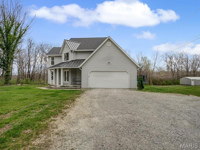 7506 D Rd, Waterloo, IL 62298 - view of front of home featuring driveway, a porch, a front yard, and a garage