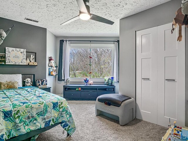 7506 D Rd, Waterloo, IL 62298 - carpeted bedroom with a textured ceiling and a ceiling fan