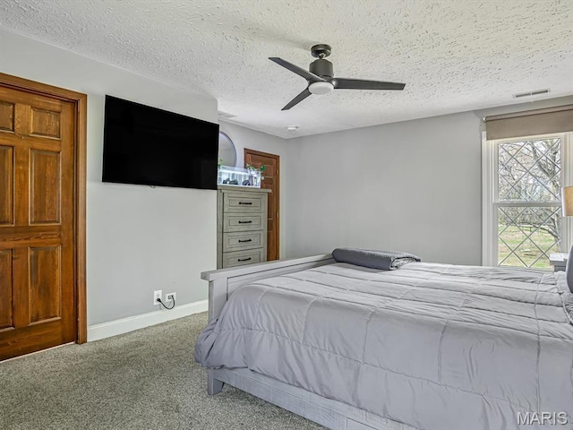7506 D Rd, Waterloo, IL 62298 - bedroom featuring carpet flooring, a textured ceiling, ceiling fan, and baseboards