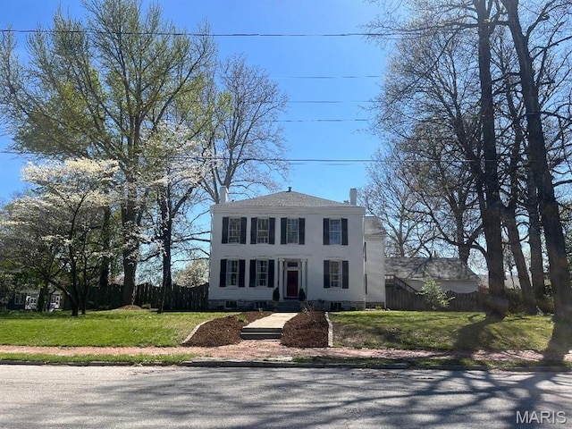 445 E 12th St, Alton, IL 62002 - view of front of home with fence, a chimney, and stucco siding