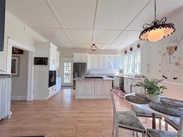 445 E 12th St, Alton, IL 62002 - kitchen with oven, a sink, dishwasher, and decorative light fixtures
