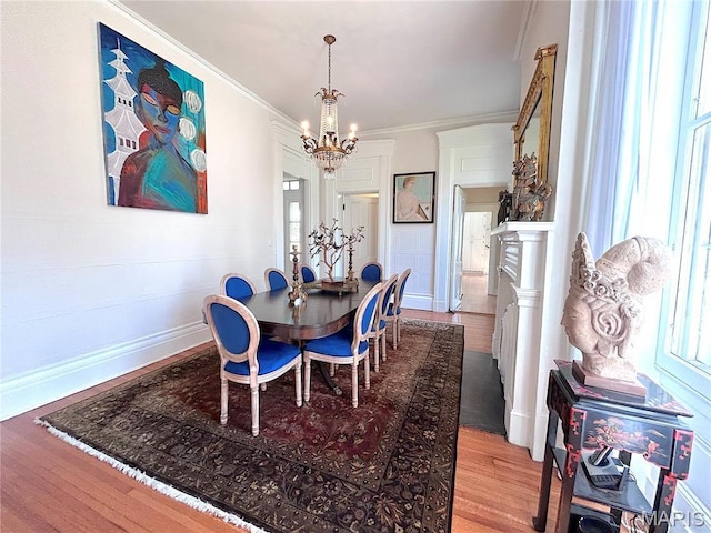 445 E 12th St, Alton, IL 62002 - dining space with a chandelier, wood finished floors, healthy amount of natural light, baseboards, and crown molding