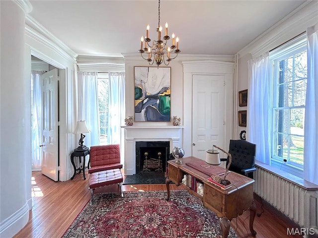 445 E 12th St, Alton, IL 62002 - home office with a chandelier, plenty of natural light, a fireplace, wood finished floors, and crown molding