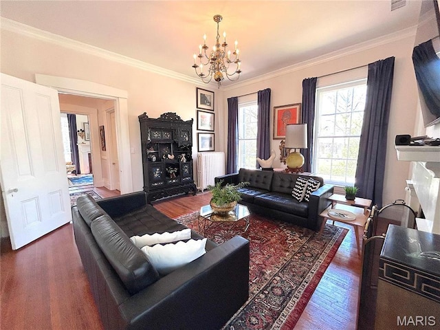 445 E 12th St, Alton, IL 62002 - living area featuring radiator, a chandelier, wood finished floors, and ornamental molding
