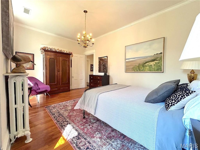 445 E 12th St, Alton, IL 62002 - bedroom featuring a chandelier, crown molding, and wood finished floors