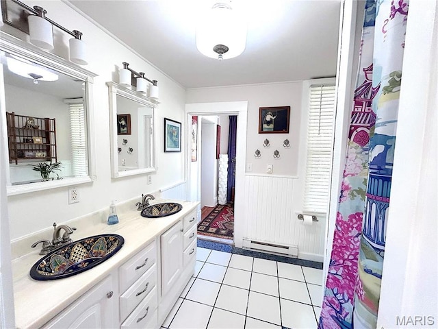 445 E 12th St, Alton, IL 62002 - full bath featuring baseboard heating, a wainscoted wall, tile patterned flooring, and double vanity