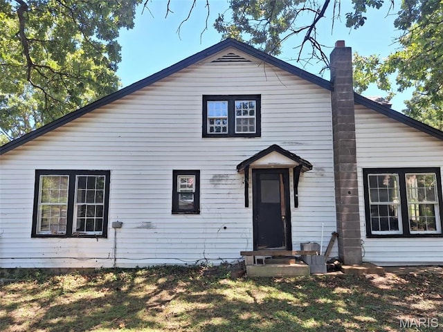 view of front of property featuring a chimney