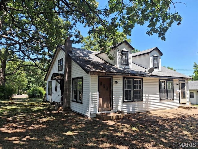 view of front of property featuring a chimney