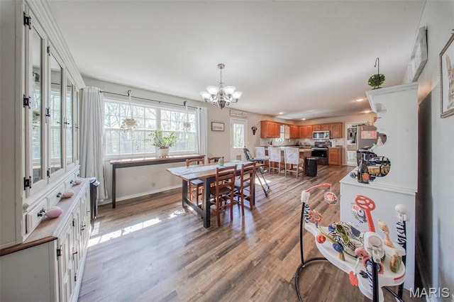 19580 Lyle Ln, Waynesville, MO 65583 - dining room with a chandelier, light wood-type flooring, baseboards, and recessed lighting