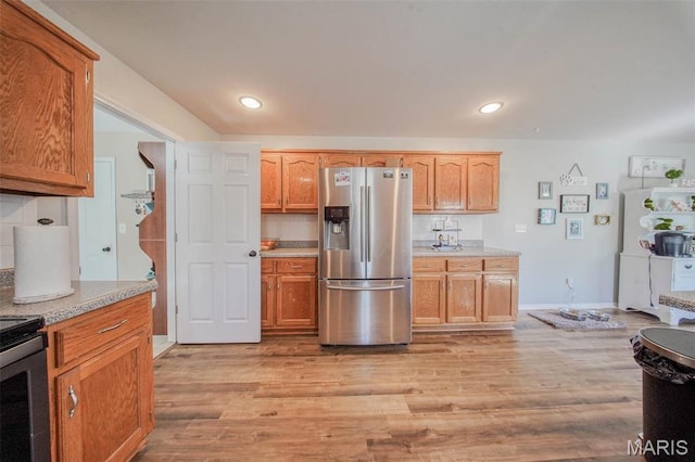 19580 Lyle Ln, Waynesville, MO 65583 - kitchen with stainless steel refrigerator with ice dispenser, light wood-style floors, light countertops, range with electric stovetop, and recessed lighting