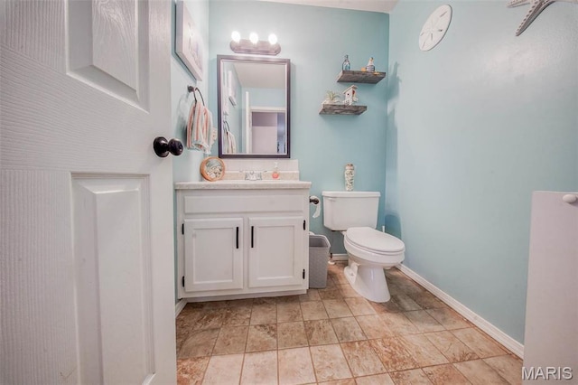 19580 Lyle Ln, Waynesville, MO 65583 - half bathroom featuring toilet, vanity, and baseboards