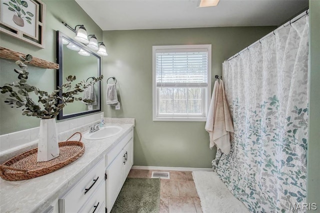 19580 Lyle Ln, Waynesville, MO 65583 - full bath with vanity, baseboards, tile patterned flooring, and curtained shower